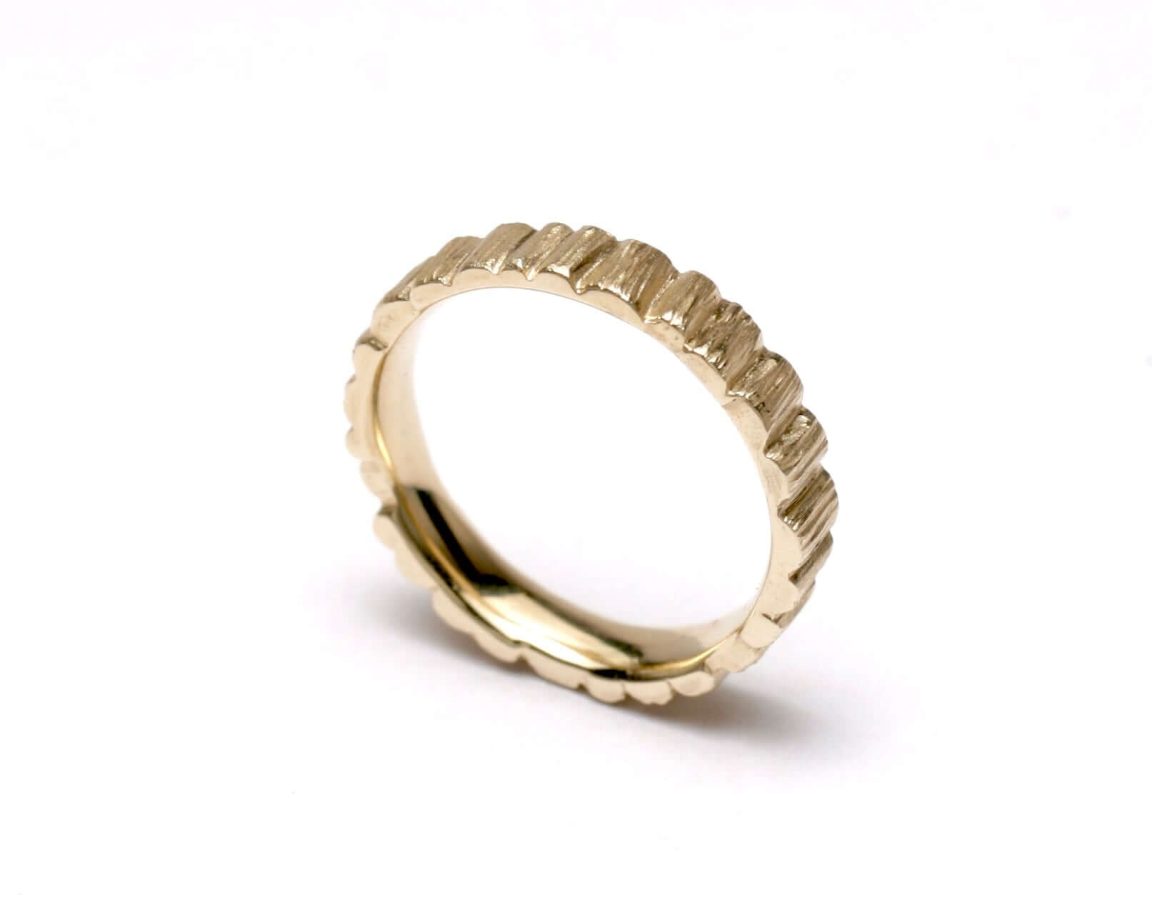 Textured gold HENGE BAND ring with rocky pillar design for unique finger jewelry.